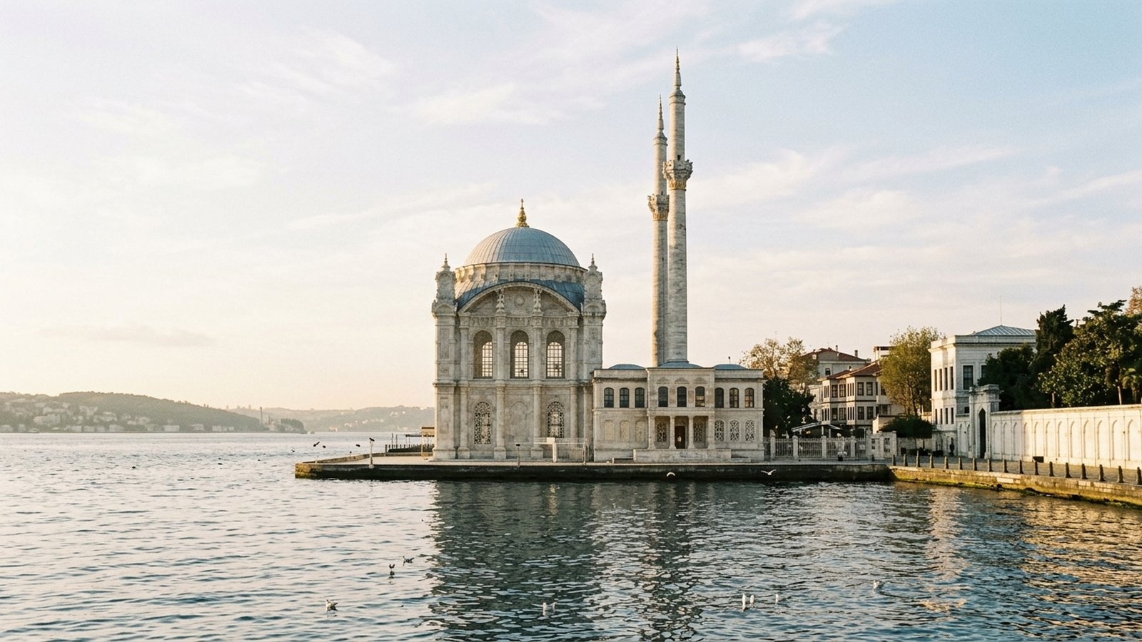 Dolmabahçe Mosque with its slender minarets on the Bosphorus waterfront beside the palace