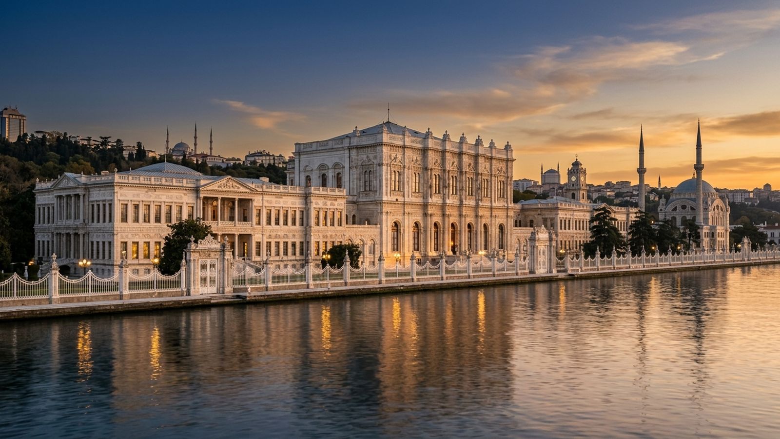 Dolmabahçe Palace waterfront facade on the Bosphorus at golden hour with its ornate white marble gates, Istanbul